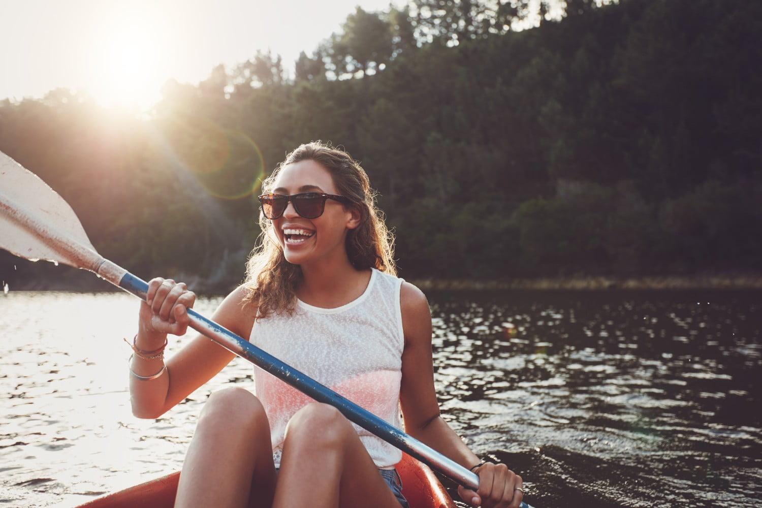 Woman kayaking on surface of frances slocum state park lake