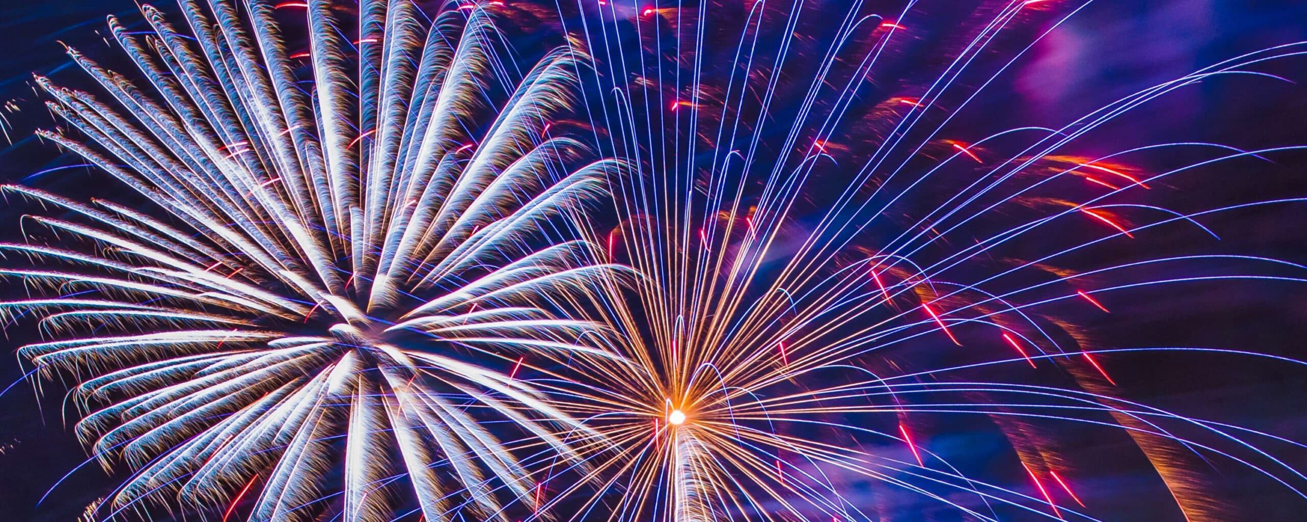 Colorful fireworks bursting in a night sky. Colorful fireworks bursting in a night sky.