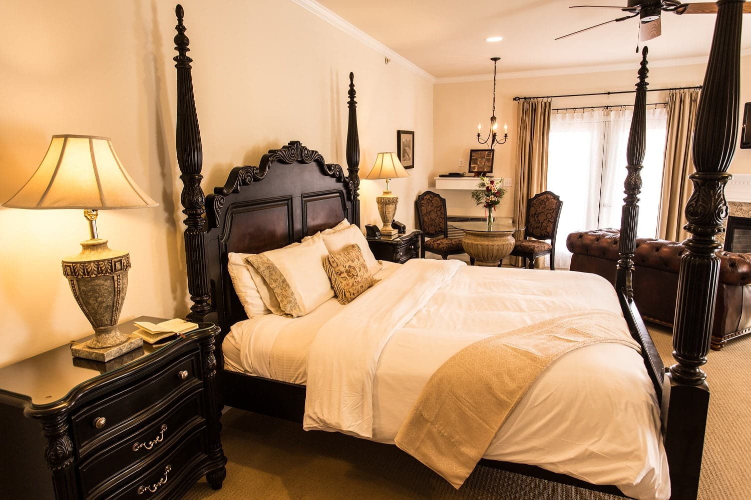 A luxurious bedroom featuring a four-poster bed, elegant furnishings, and soft lighting. A luxurious bedroom featuring a four-poster bed, elegant furnishings, and soft lighting.