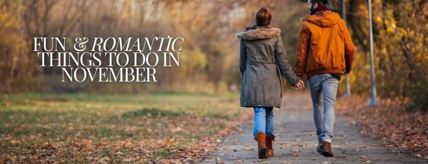 A couple walks hand-in-hand along a tree-lined path in autumn. A couple walks hand-in-hand along a tree-lined path in autumn.