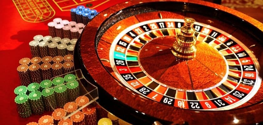 roulette table, wheel, and chips at a casino
