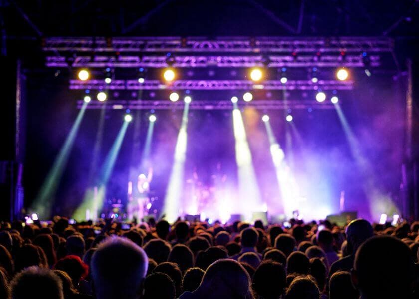 people at a concert with a view of the stage people at a concert with a view of the stage